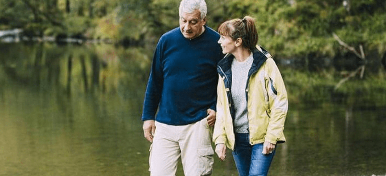 Couple walking by lake