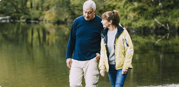 Couple walking by lake
