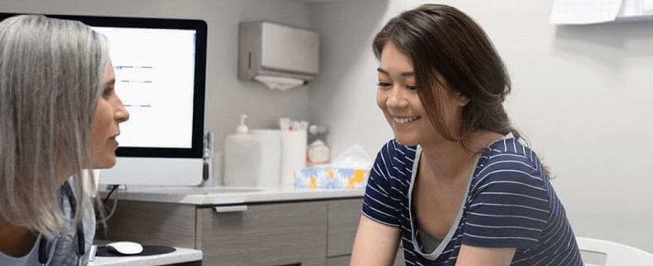 Doctor and patient smiling