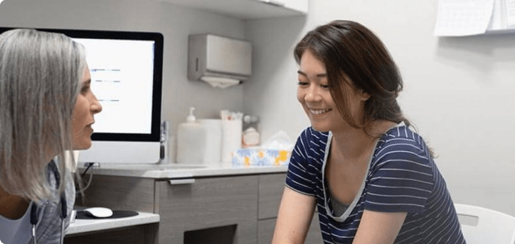 Doctor and patient smiling