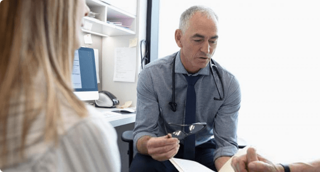 Doctor speaking with patients