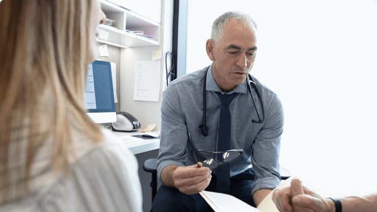 Doctor speaking with patients