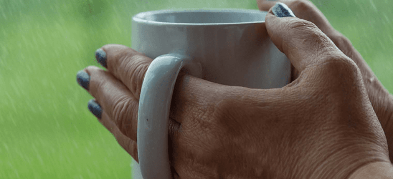 Hand holding a hot drink