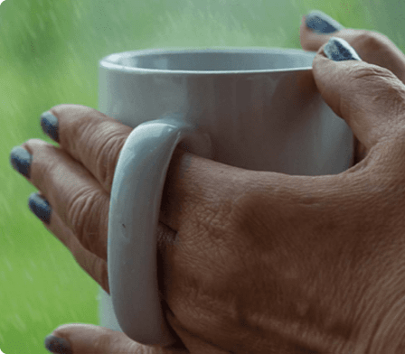 Hand holding a hot drink