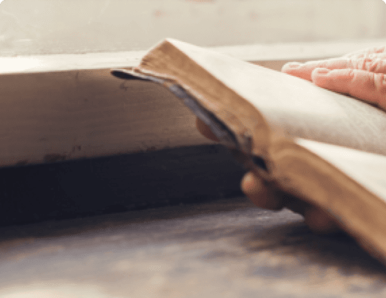 Hands holding book open