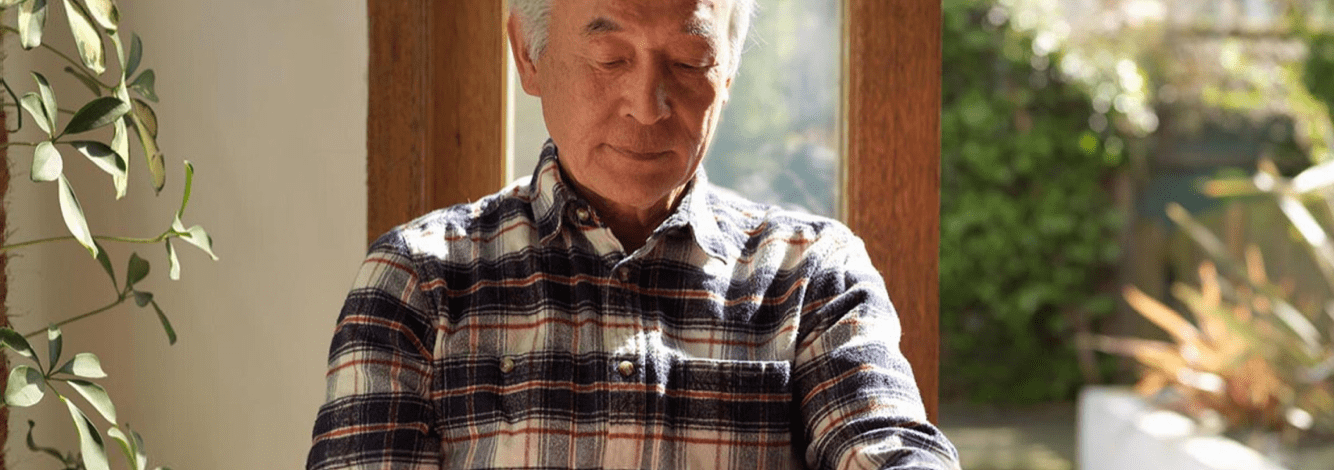 Man looking down by home entrance