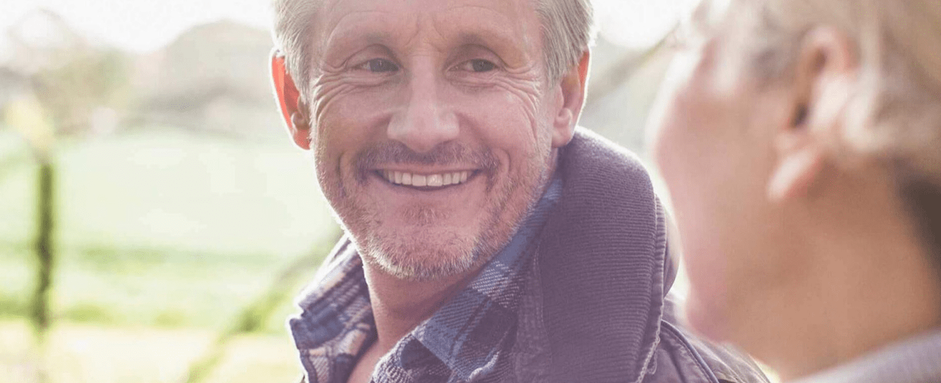 Man smiling at woman