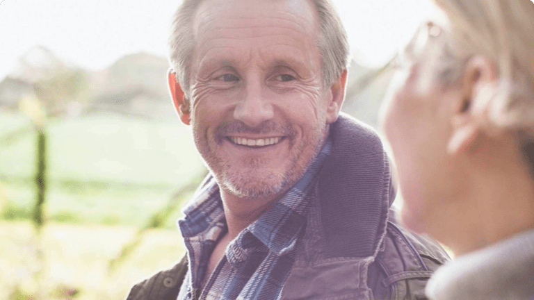 Man smiling at woman