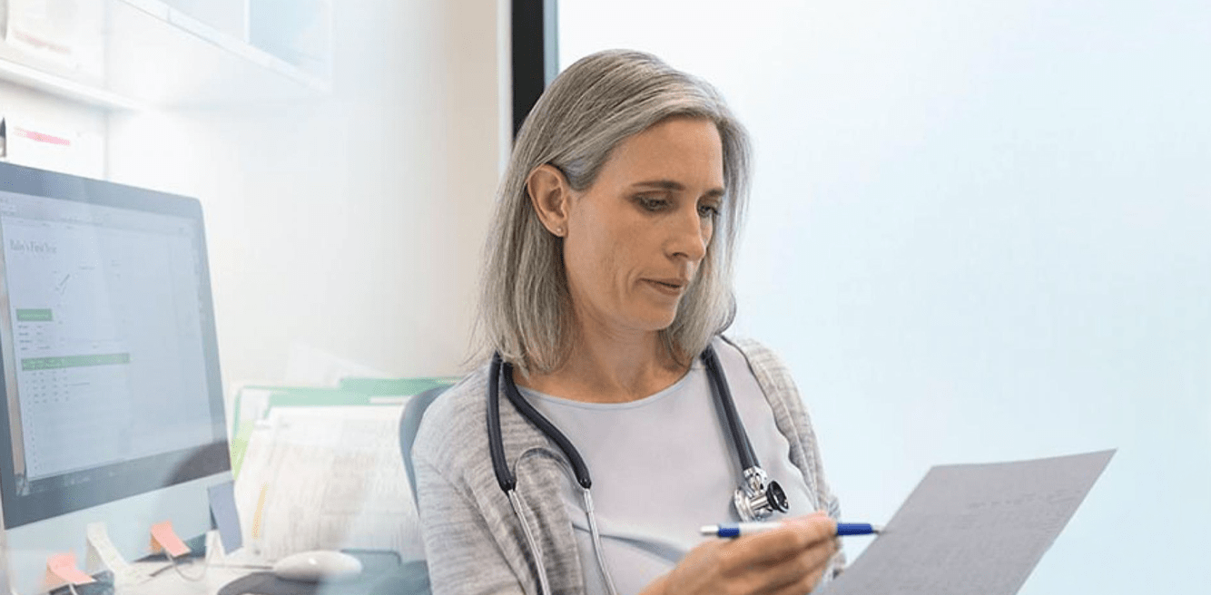 Woman checking medical charts