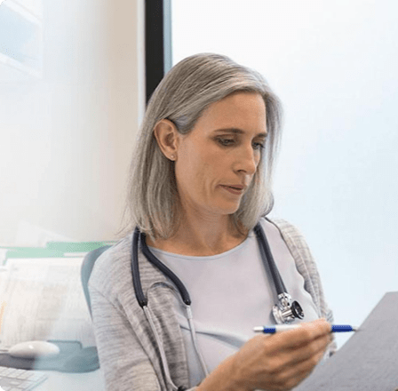 Woman checking medical charts