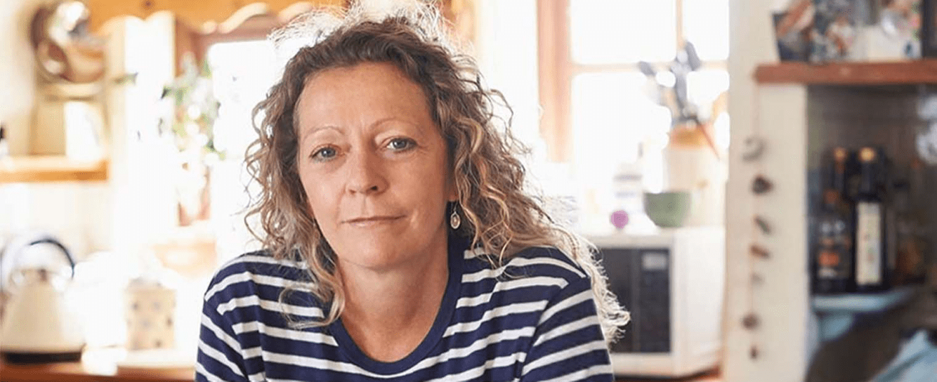 Woman staring at camera with stripey top