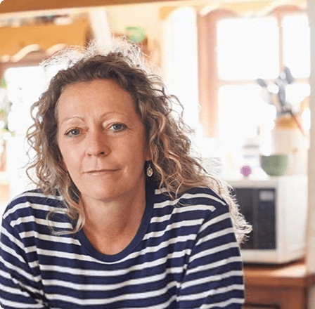 Woman staring at camera with stripey top