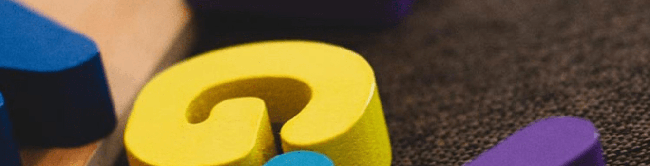 Wooden alphabet blocks on carpet