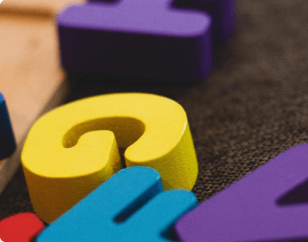 Wooden alphabet blocks on carpet